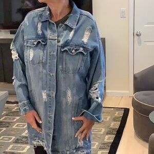 Denim long jacket with distressed details. Excellent condition.
